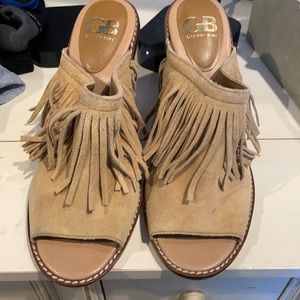 Peep toe fringe mules